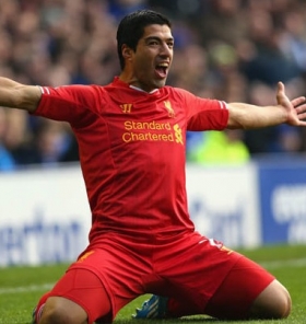 Luis Suarez happy at Liverpool
